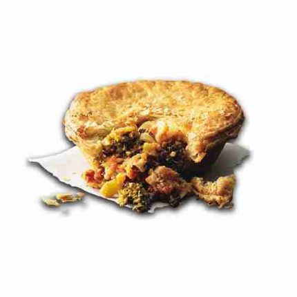 Veg-ilicious Pie cut open to show kale, broccoli, cauliflower, and millet in tomato basil sauce.